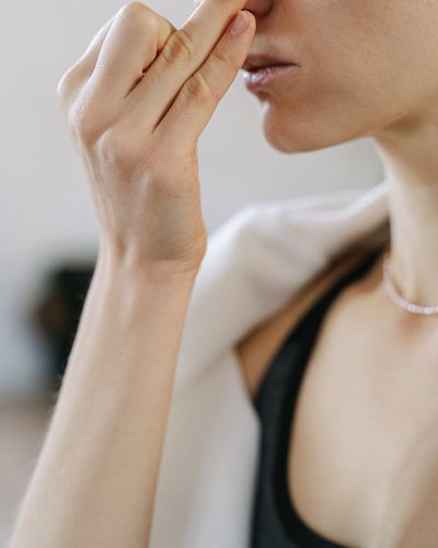 Close-up of hands in a meditative yoga pose.